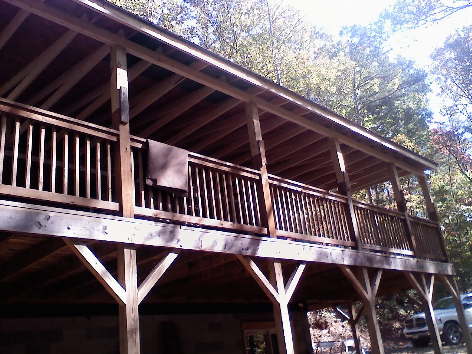Timber framing under a new elevated porch and deck — Roof Leak Repair in Preston Hollow by Roofing Brothers